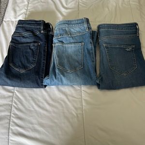 Three pairs of Hollister jeans.